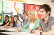 Photo: Teenage Students Studying In Classroom Answering Question Teenage Students Studying In Classroom Answering Question