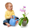 Adorable baby smiling and watering flower