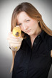Image of girl holds banana as a gun Image of girl holds banana as a gun