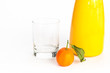 Jug of orange juice, glass and an orange