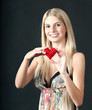 Beautiful young blond girl with heart