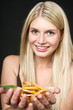 Young beautiful woman with drying orange slices