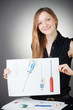 Young Design Engineer Woman Shows a Screwdriver Design Plan Young Design Engineer Woman Shows a Screwdriver Design Plan
