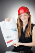 Young Design Engineer Woman Shows a Screwdriver Design Plan Young Design Engineer Woman Shows a Screwdriver Design Plan