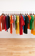 Variety of multicolored clothes on a rod Variety of multicolored clothes on a rod