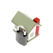 miniature house with lock isolated on white