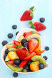 Fruity summer salad in white bowl Fruity summer salad in white bowl