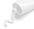 white cream tube body care product
