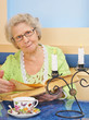 senior lady holding a book