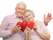 happy old couple with red hearts happy old couple with red hearts