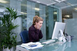 Shocked businesswoman at desk in office