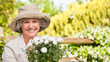 Smiling woman in her garden Smiling woman in her garden