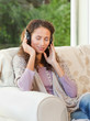 Radiant woman listening to music