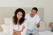 Young couple having a dispute on the bed