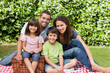 Photo: Family picnicking in the garden Family picnicking in the garden