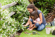 Mother and daughter working in the garden Mother and daughter working in the garden