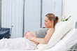 Photo: Pregnant young woman on a hospital bed Pregnant young woman on a hospital bed