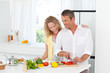 Couple cooking together in their kitchen