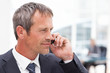 Businessman phoning in his office Businessman phoning in his office
