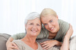 Wonderful nurse and her mature patient looking at the camera