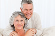 Mature woman hugging her husband Mature woman hugging her husband