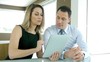 Video: Sales people working on electronic tablet Sales people working on electronic tablet