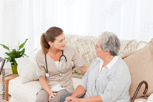 Photo: Nurse talking with her patient Nurse talking with her patient