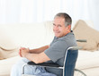 Mature man in his wheelchair looking at the camera Mature man in his wheelchair looking at the camera