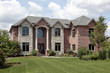 Brick home with white columns Brick home with white columns