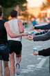Runners taking water