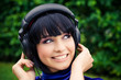 pretty young smiling woman listening music