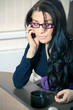 Foto: Businesswoman sitting in office Businesswoman sitting in office