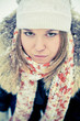 Happy young woman plays with a snow
