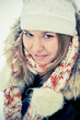 Happy young woman plays with a snow