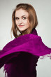 Portrait of young girl enveloped into violet scarf in profile Portrait of young girl enveloped into violet scarf in profile