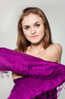 Portrait of young girl enveloped into violet scarf Portrait of young girl enveloped into violet scarf