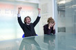 Happy businessman and unhappy businesswoman