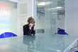 Young businesswoman in conference room crying