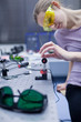 female scientist doing research in a quantum optics lab (color t