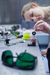 female scientist doing research in a quantum optics lab