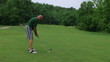 Golfer Hitting Ball With Iron