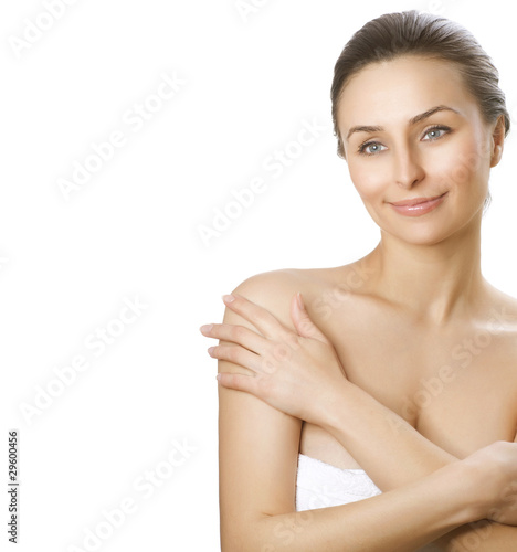 Photo: Beautiful Young Woman applying moisturizer. Spa concept Beautiful Young Woman applying moisturizer. Spa concept
