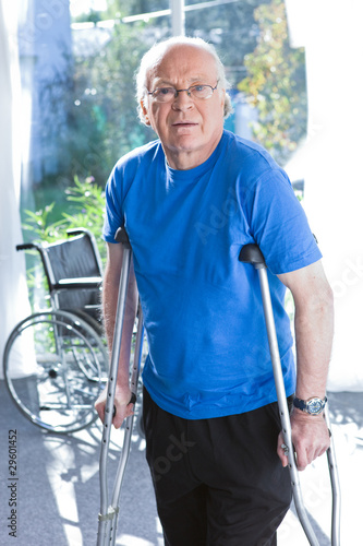 Photo: Senior man with crutches Senior man with crutches