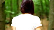 Beautiful young woman runs in woods