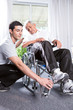 Helping a disabled man to stand up