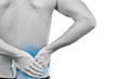 young caucasian man with pain in a back isolated on white
