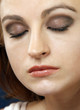 Closeup portrait of a woman, eyes closed, make-up shot