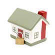 miniature house with lock isolated on white