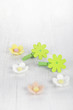 decorative flower pegs with sugar flowers on white old table decorative flower pegs with sugar flowers on white old table