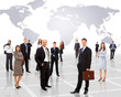Businessmen standing in front of an earth map